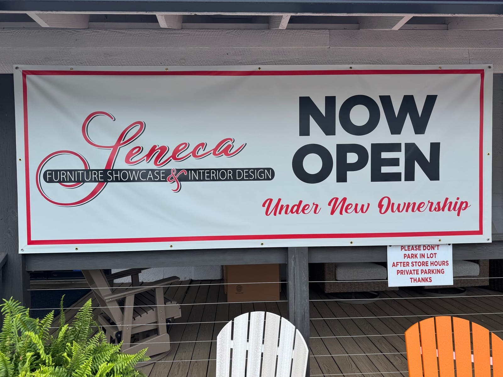 Seneca Furniture Showcase & Interior Design 'Now Open Under New Ownership' banner outside the store